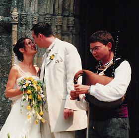 Happy couple being deafened at own wedding